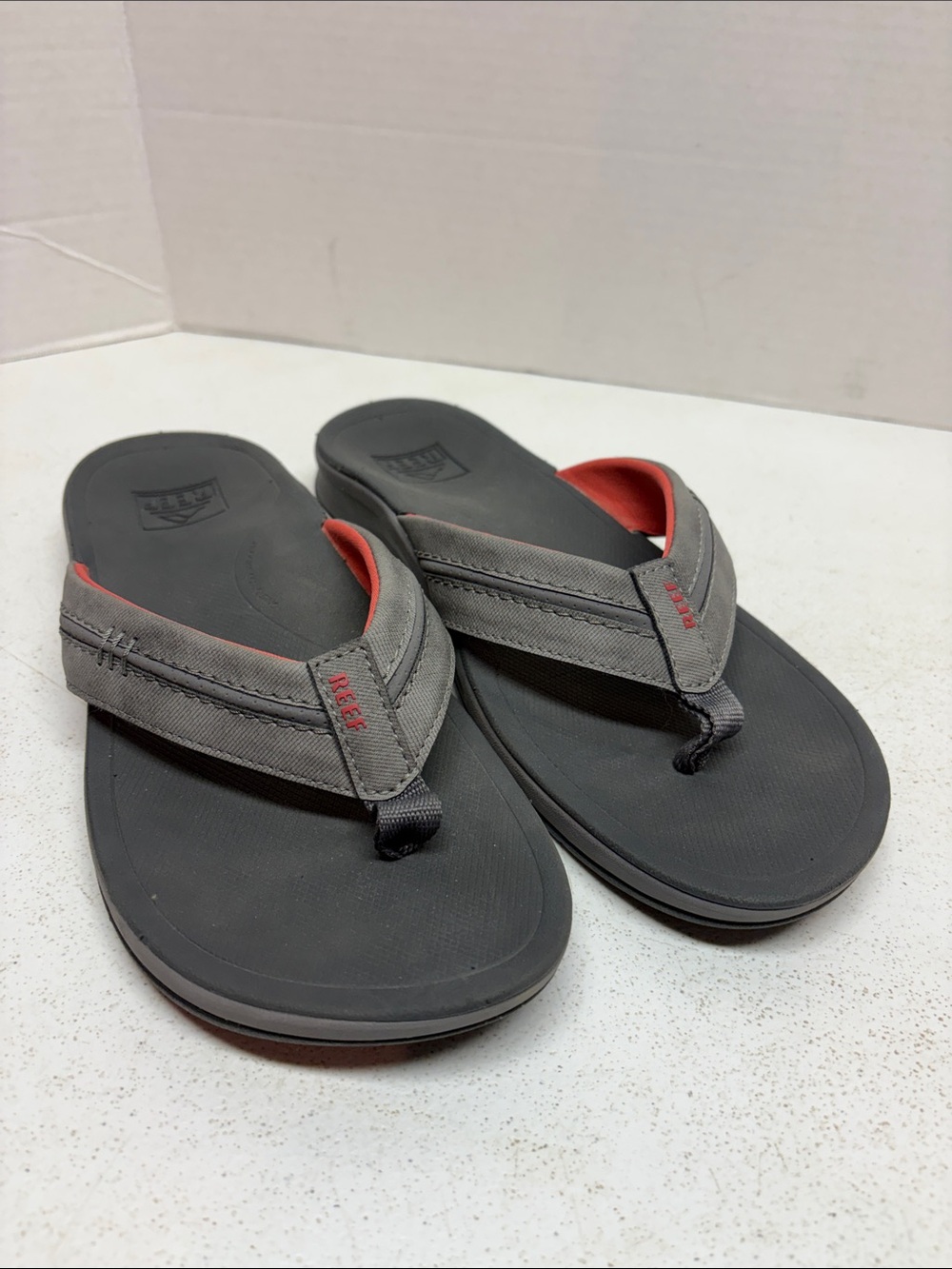 Reef Men’s Gray Flip Flops with Red Accent